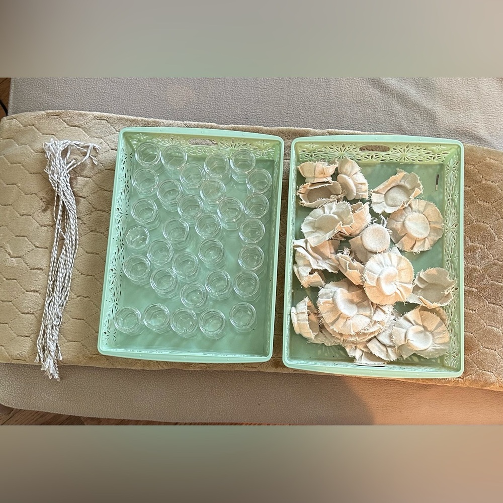 Collection of tiny jars with cloth lids